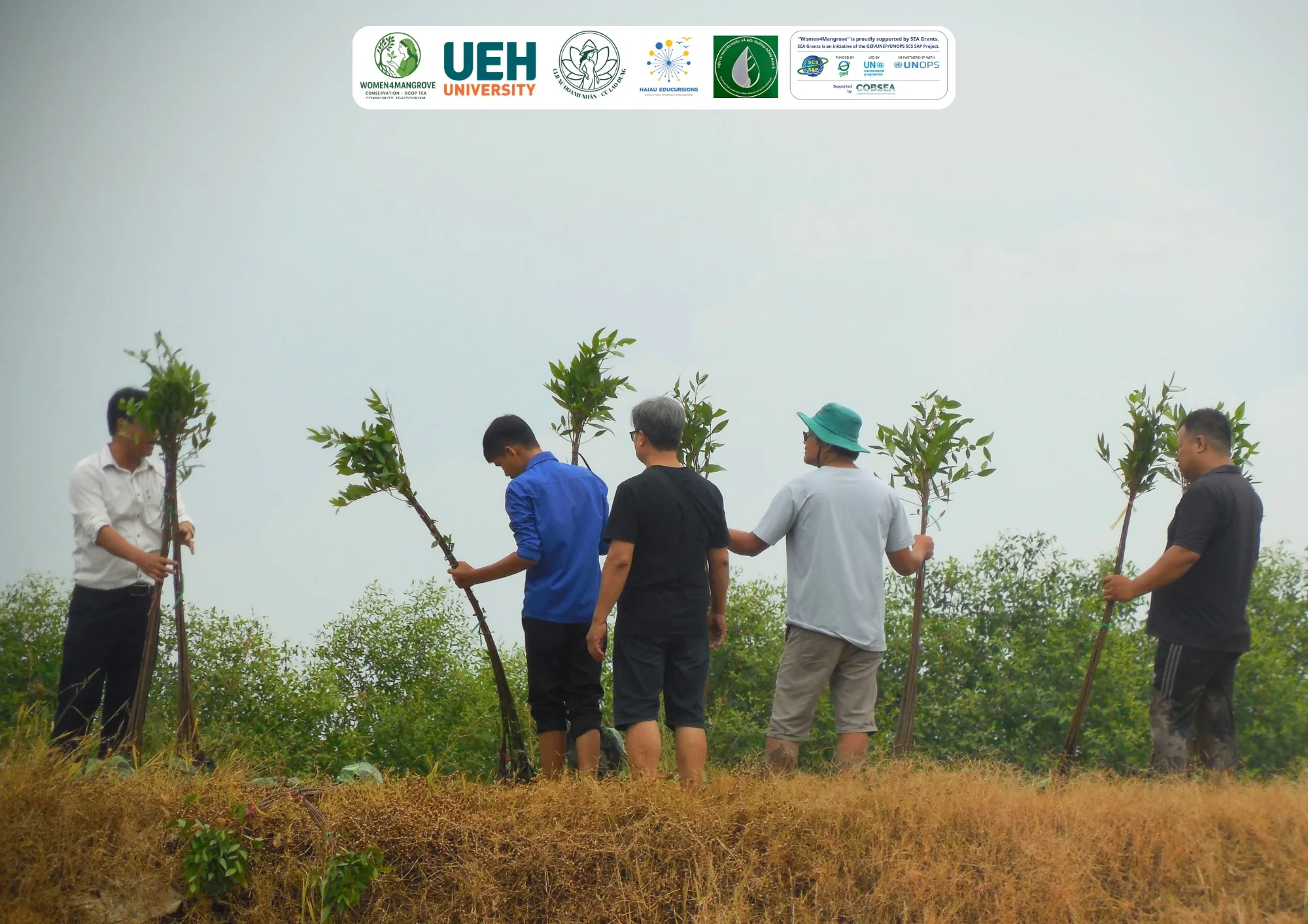 Participants preparing mangrove apple (Sonneratia caseolaris) seedlings for planting along the riverbank in An Thanh
